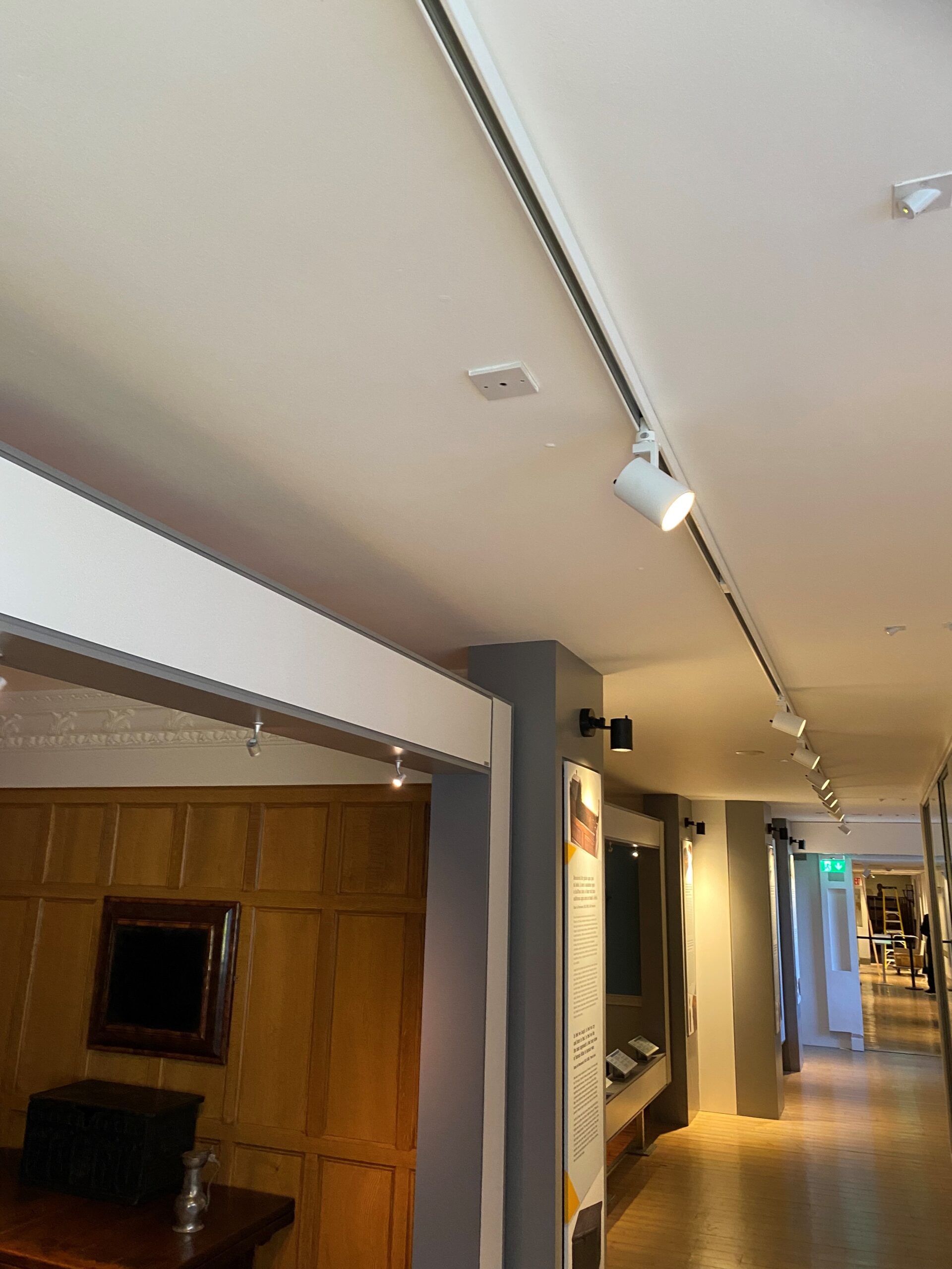 Irish National Gallery wood-panelled corridor lit by ENCORE TLI-50 spotlights on a ceiling track rail