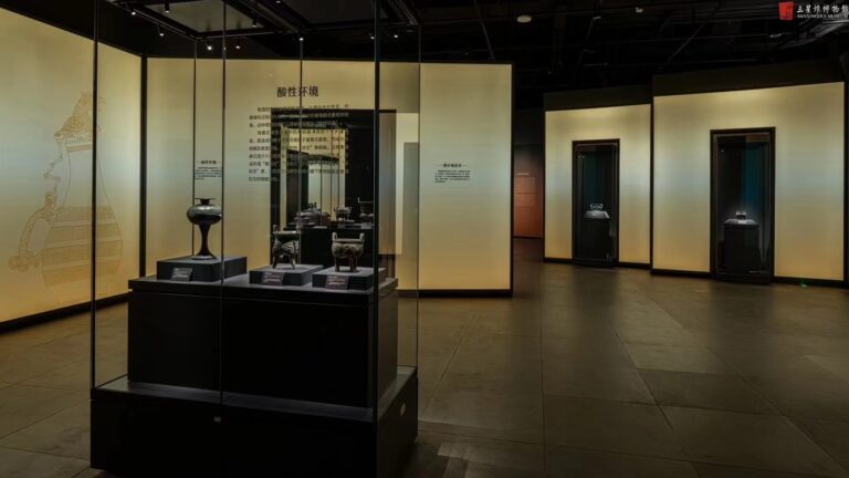 Sanxingdui Ruins Museum bronze vessel lit by museum-grade track lighting and downlights