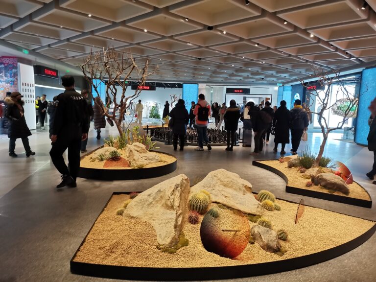 Beijing SKP luxury fashion concourse lit by recessed downlights and warm track lighting
