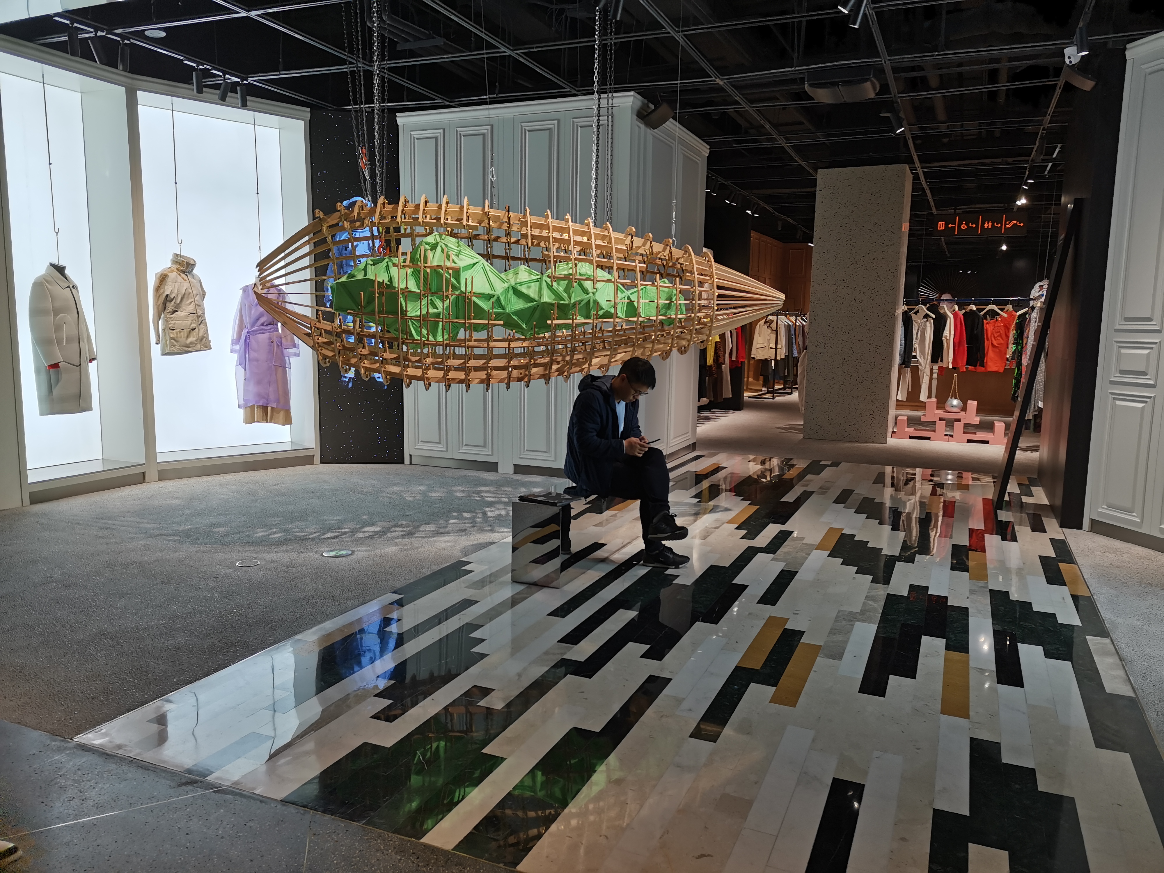 Beijing SKP retail zone with coffered ceiling downlights and brand accent lighting