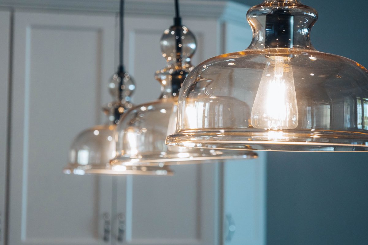 Glass pendant lighting above a modern dining space creating a decorative focal point
