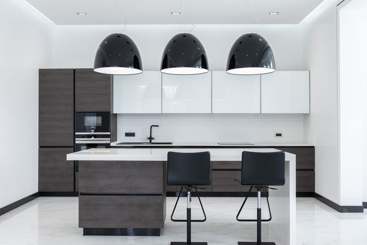 Pendant lighting over a kitchen island providing task light and decorative warmth