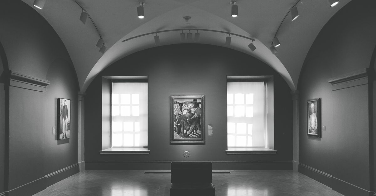 Wall washing track lighting illuminating an elegant art museum gallery