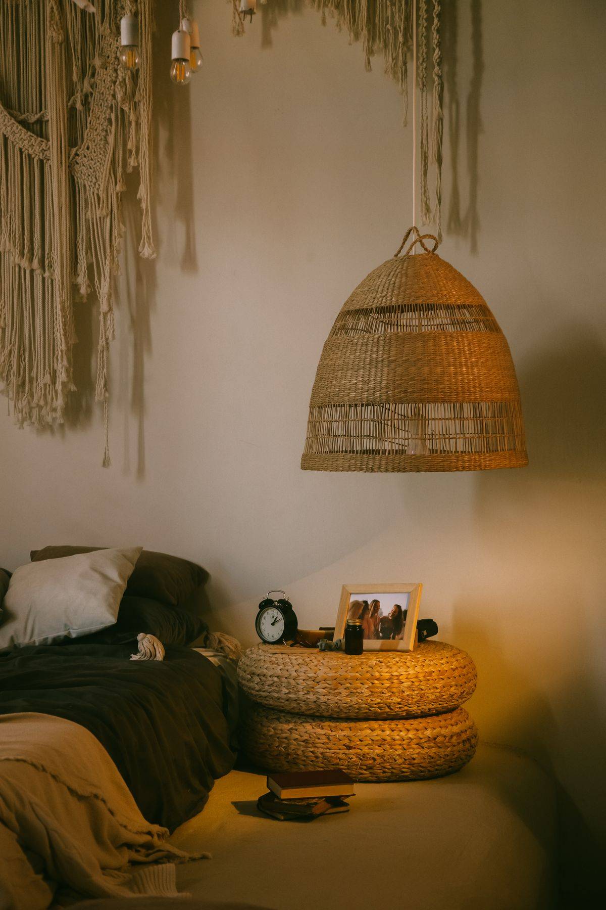 Warm bohemian bedroom with wicker decor and textured textiles creating a cozy atmosphere