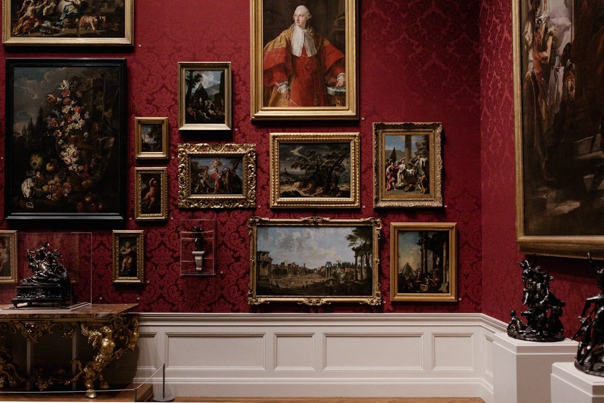 Museum interior with artworks and display cases illuminated by high-CRI museum lighting
