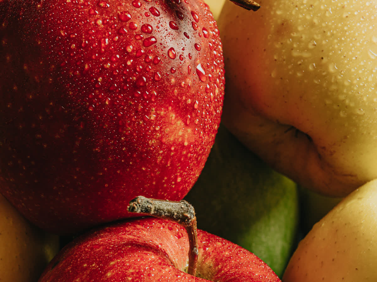 Close up of a wet dark red apple showing the deep saturated color a high R9 light source reveals without losing shadow detail