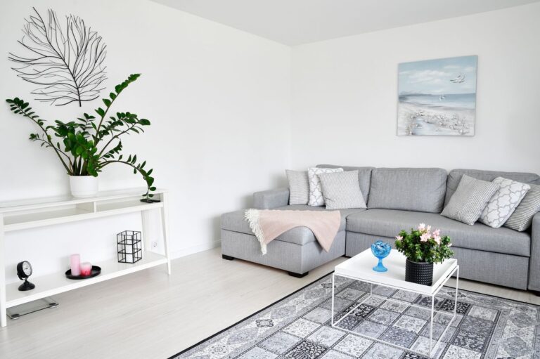 Bright Nordic Scandinavian living room in Espoo Finland with grey sofa and natural daylight
