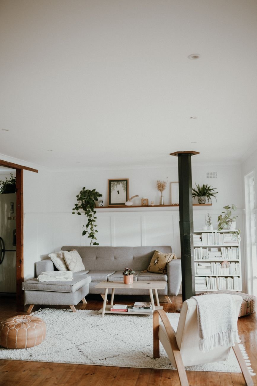Warm and inviting Scandinavian living room with neutral decor and indoor plants at comfortable lux levels